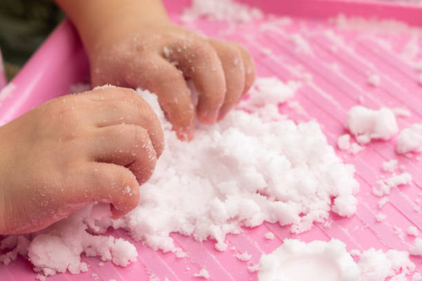 istock Child plays with artificial snow for home decoration 1295814720