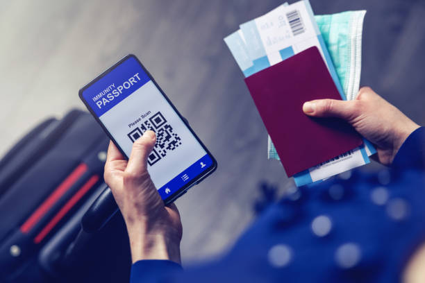 istock tourist using immunity passport app in mobile phone for travel 1295815162