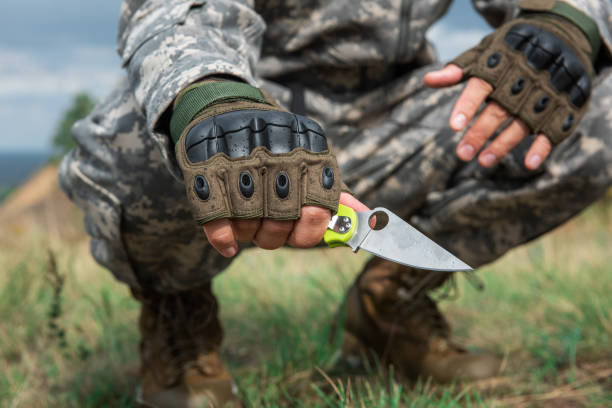 istock A man with a knife in the forest 1295815254