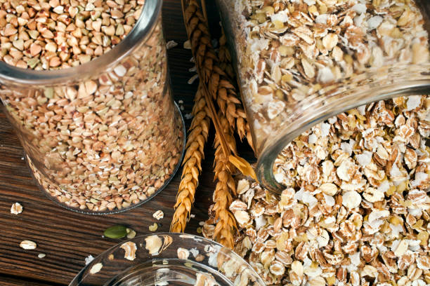 istock Green buckwheat and oat flakes with wheat ears 1295815487