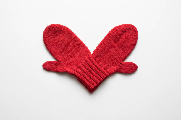 Valentines day card with a heart made of red mittens on a white background and copy space for text