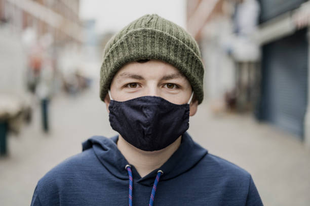 istock Portrait of a young man in protective face mask 1295816781