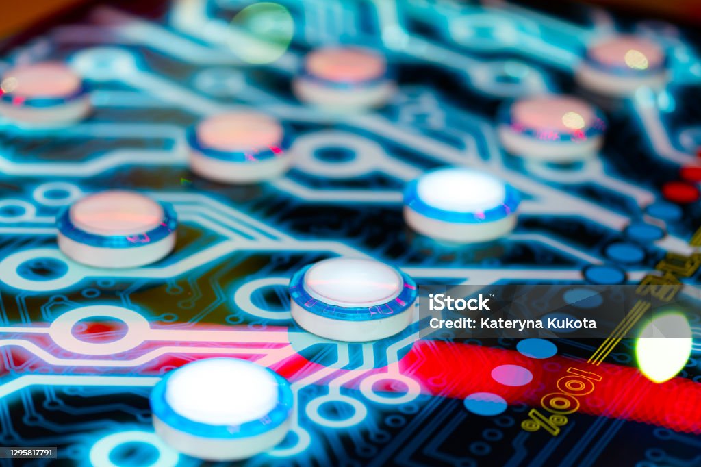 Close-up of an electronic arcade game. Board game button abstraction Close-up of an electronic arcade game. Board game button abstraction. Pinball Machine Stock Photo