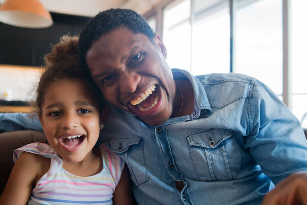 istock Daughter and father at home. 1295818760