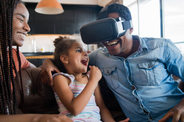 istock Family playing video games with VR glasses. 1295818763