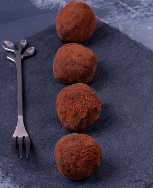istock Chocolate truffles with cocoa powder 1295818857