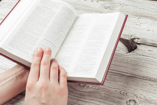 istock Woman reading the Holy Bible 1295819178