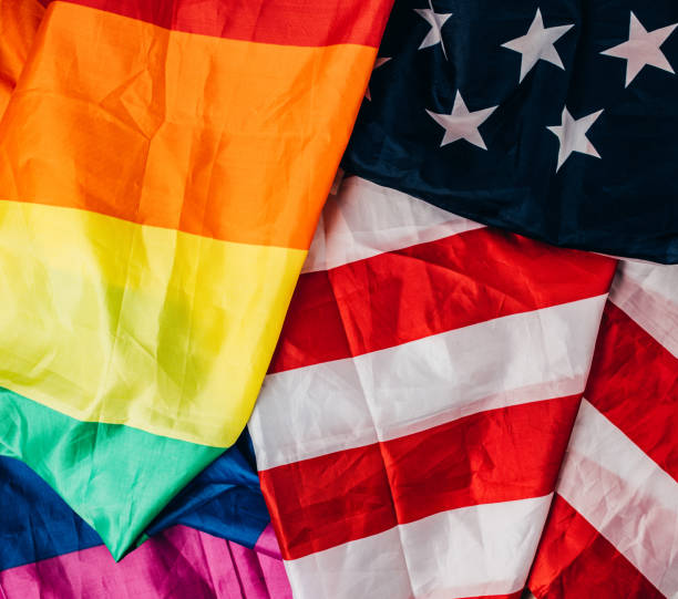 istock US national and LGBTQI flag 1295819354