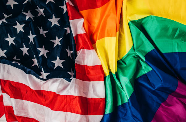 istock US national and LGBTQI flag 1295819387