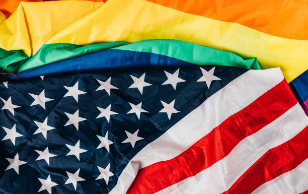 istock US national and LGBTQI flag 1295820179