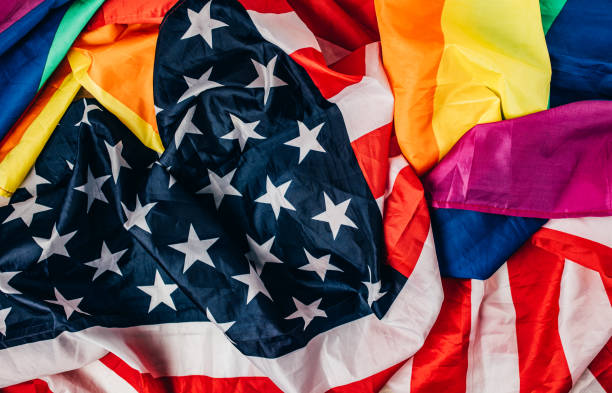 istock US national and LGBTQI flag 1295820254