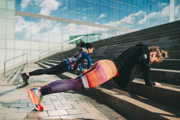 istock Sportswomen exercising push-ups 1295821693