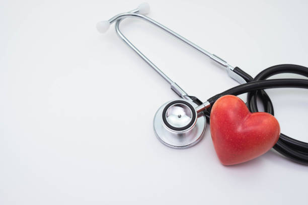 istock stethoscope and red artificial heart on a white background on the table 1295822044
