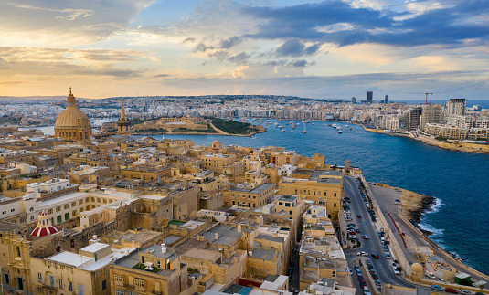 Aerial panorama view of Valletta and Manoel island. Sunset sky, cloudy