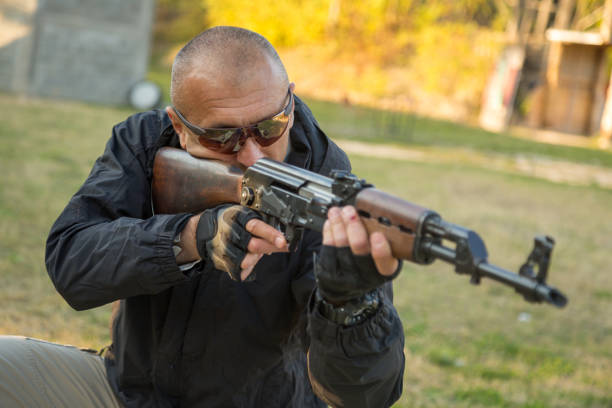 istock The security operative trains with weapon at shooting range 1295822377
