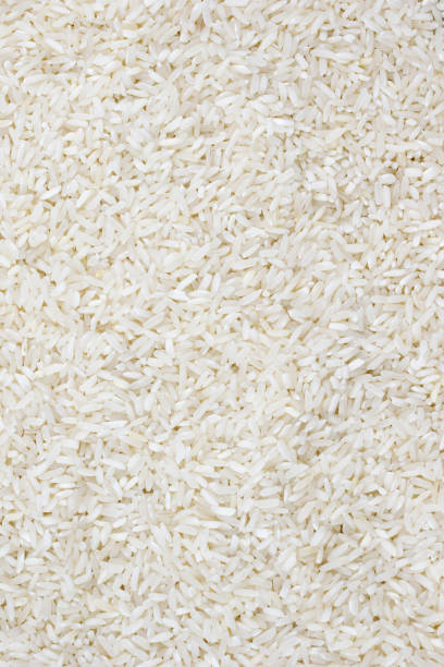 istock macro photo of white rice. background or texture 1295830699