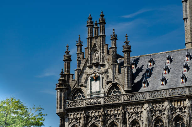Middelburg, Netherlands, August 2019. Details of the magnificent gothic style town hall, beautiful summer day.