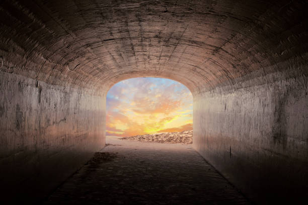 istock cement tunnel with sunrise sky glow 1295833305