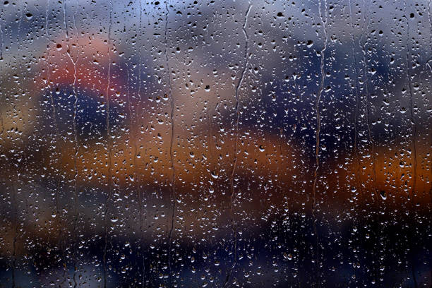 istock Window with rain or water drops from stormy weather 1295833614