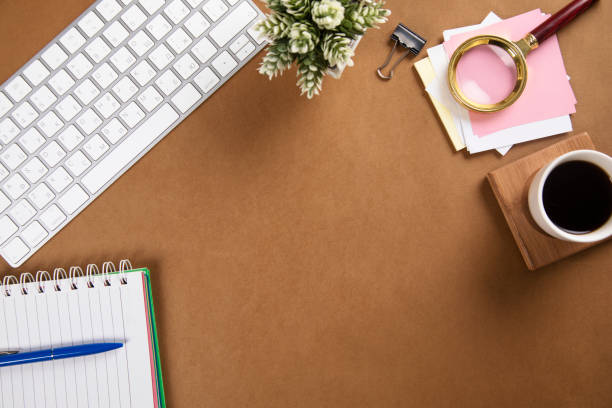 istock notepad with keyboard and coffee on paper background 1295836467