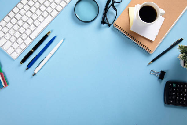 istock keyboard with notepad and coffee with stationary 1295836473