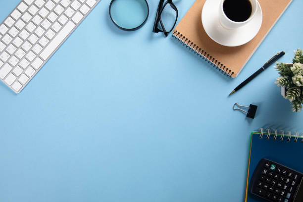 istock keyboard with notepad and coffee with stationary 1295836484