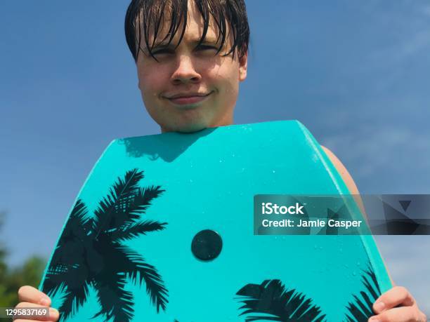 Cute Smiling Teenage Boy At The Beach Stock Photo - Download Image Now - Michigan, Photography, Relaxation