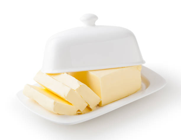 istock Fresh butter on white butter dish isolated on white background with clipping path 1295837208