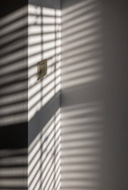 istock Shadow floor. Abstract light, black shadow overlay from window on white texture wall. Sunlight architecture background. Overlay effect for photo and design. 1295837377