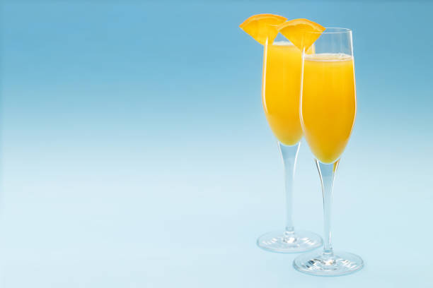 istock Two glasses of mimosa cocktail 1295837631