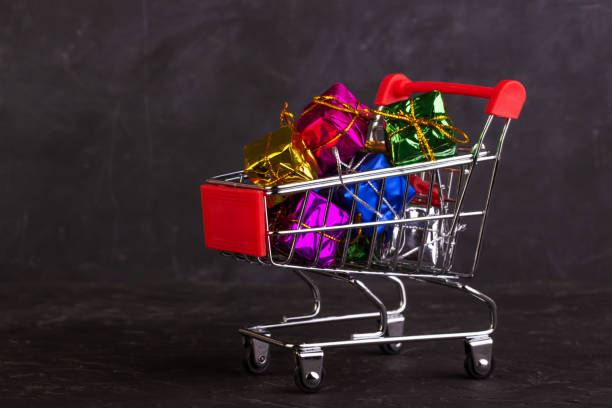 istock Gift boxes in a shopping trolley 1295837719