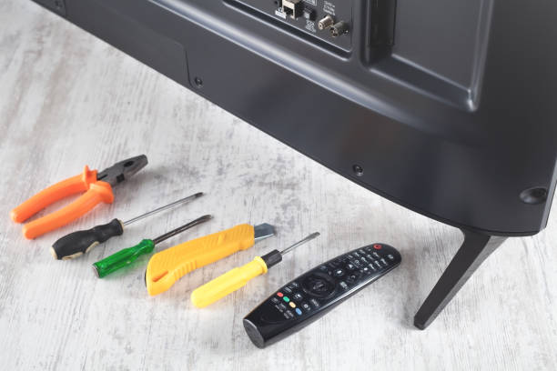 istock Tv and repairing tools on the table. 1295839317