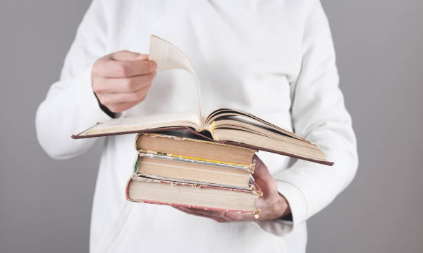 istock Caucasian man holding bible. Religion 1295839323