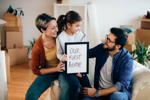 istock Happy family talking while moving into their first home. 1295843303