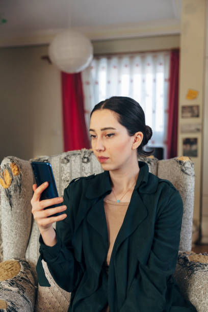 istock Young Women Holding Smartphone 1295843390