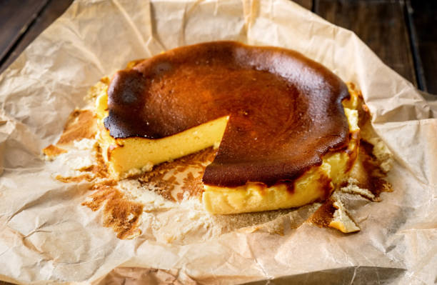 istock Delicious basque burnt cheesecake on rustic table on baking paper 1295845034