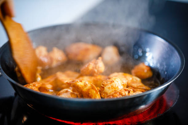 istock Breaded chicken nuggets frying in pan 1295849091