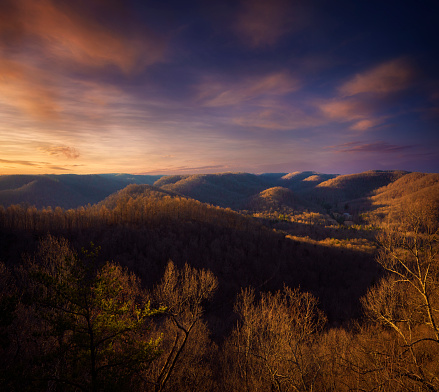 The sun rises over the valley during a winter morning at Indian Fort Mountain, a viewpoint in the Pinnacles mountain range near Berea, Kentucky.