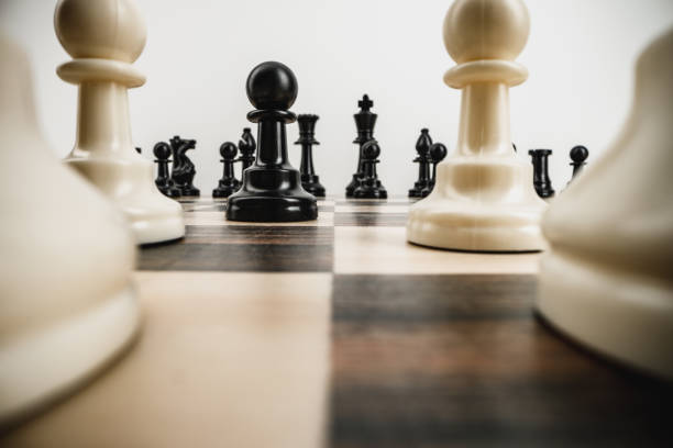istock Macro photo of chess pieces on a chess board 1295849934