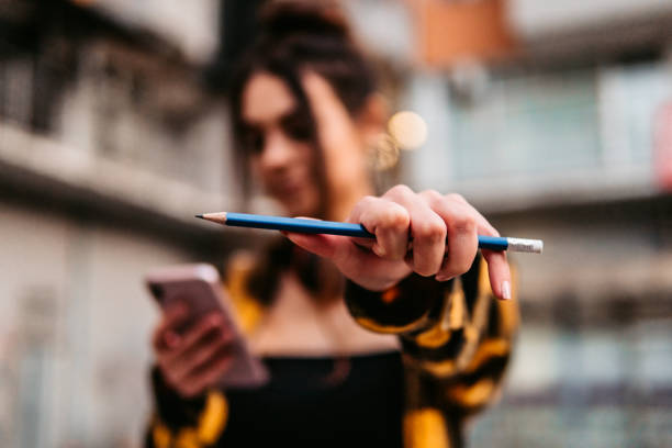 istock Holding pencil in fist 1295850021