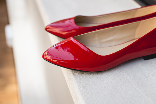 Patent leather women's shoes. Classic and fashionable high heeled female footwear.