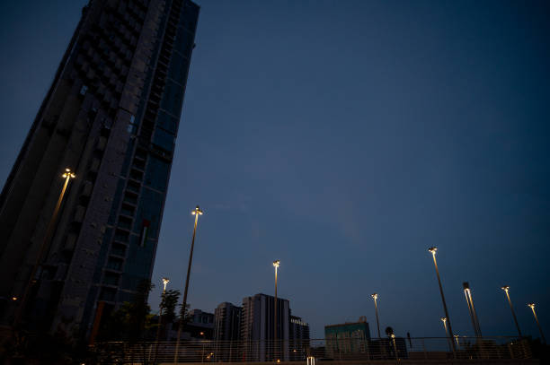 Night view of a skyscraper and street lights in Abu Dhabi, UAE stock photo