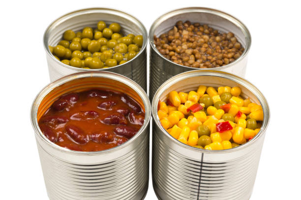 istock Canned food on white background. Green pea, beans, corn, lentils. 1295853605