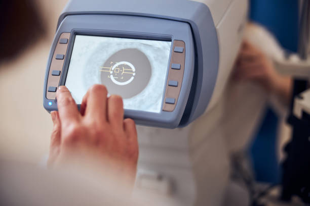 istock Experienced doctor using machine while checking eyesight of patient in office of pediatric ophthalmology 1295856878