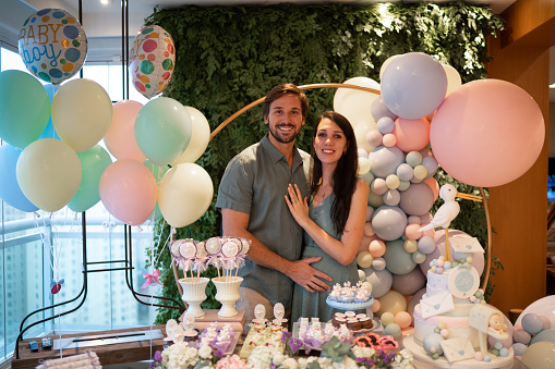 Portrait of couple during their gender reveal party