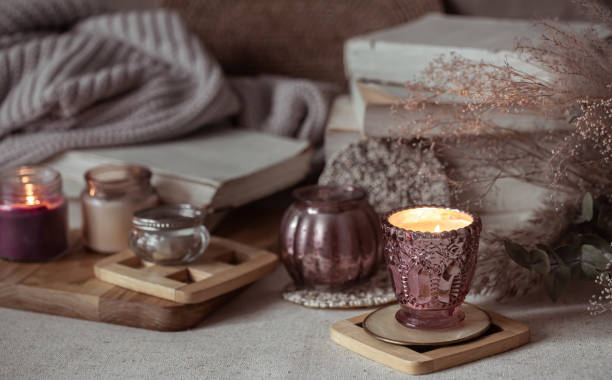 istock Composition of beautiful vintage candlesticks with burning candles on a blurred background. 1295857955