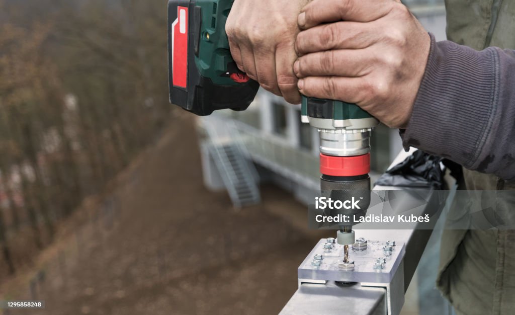 Cordless Drilling Machine In Workman Hands Jig Bushing Of Aluminum And  Acrylic Glass Stock Photo - Download Image Now - iStock