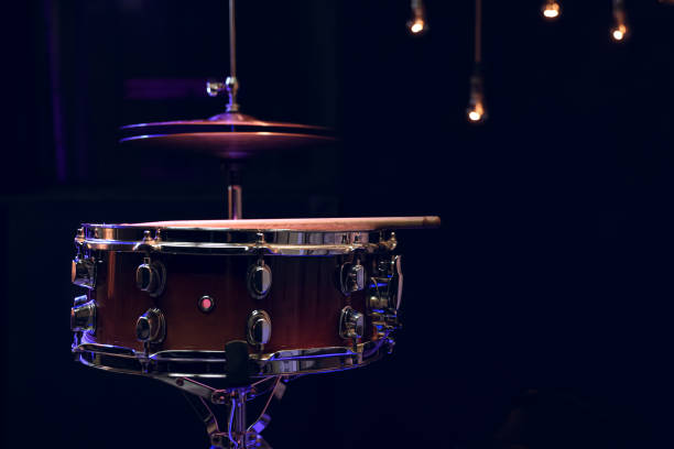 istock Snare drum on dark blurred background close up. 1295858280