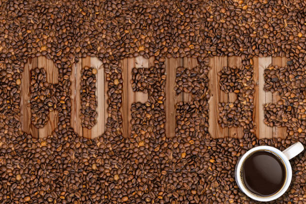 istock coffee beans and mug lettering 1295860415