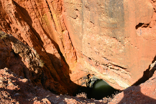 Algarve / Faro District, Portugal: Sinkhole (algar) at Altar Headland - limestone erosion and collapsed creates wells and galleries connecting the surface to the sea - Ponta do Altar